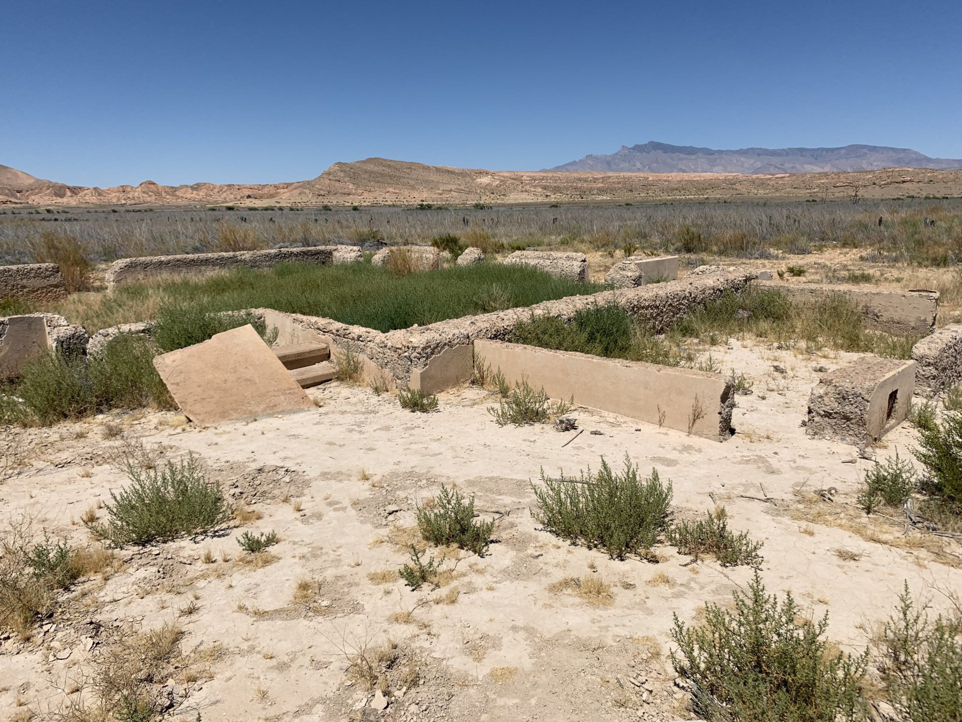 The St. Thomas ghost town in Las Vegas offers a sight of broken pieces of the abandoned buildings buried in the desert landscape