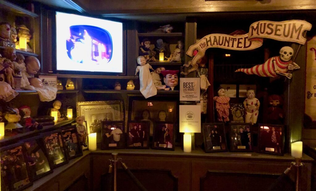 Zak Bagans' Haunted Museum presents a chilling collection of allegedly haunted objects and paranormal artifacts like a retro television, dolls, awards and picture frames that make atmospheric setting that evokes a sense of mystery and intrigue.