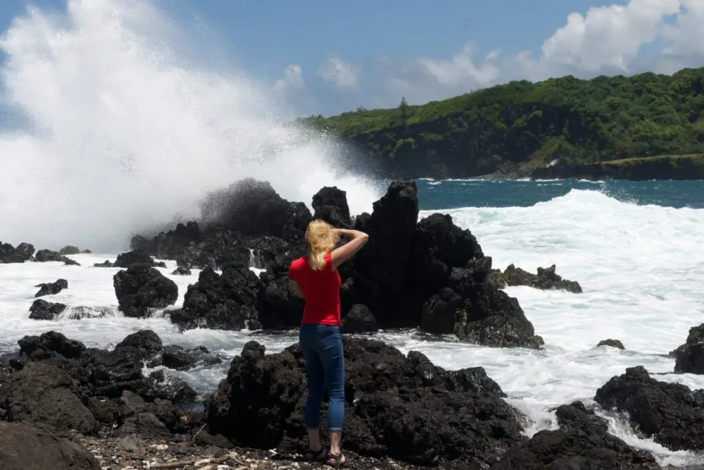 Maui's Hana coast offers rejuvenation for both the mind and body with black-sand beaches, cascading waterfalls, and a challenging drive. 