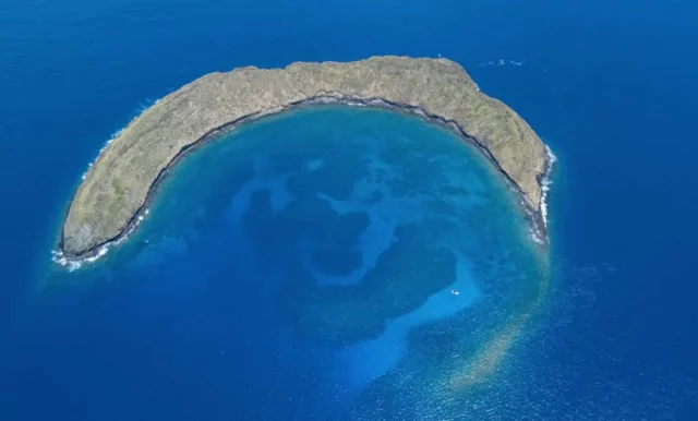 Molokini Crater is located a short distance from Maui's coast, with a volcano partially underwater and showcasing abundant marine life and amazing Molokini snorkeling opportunities. 