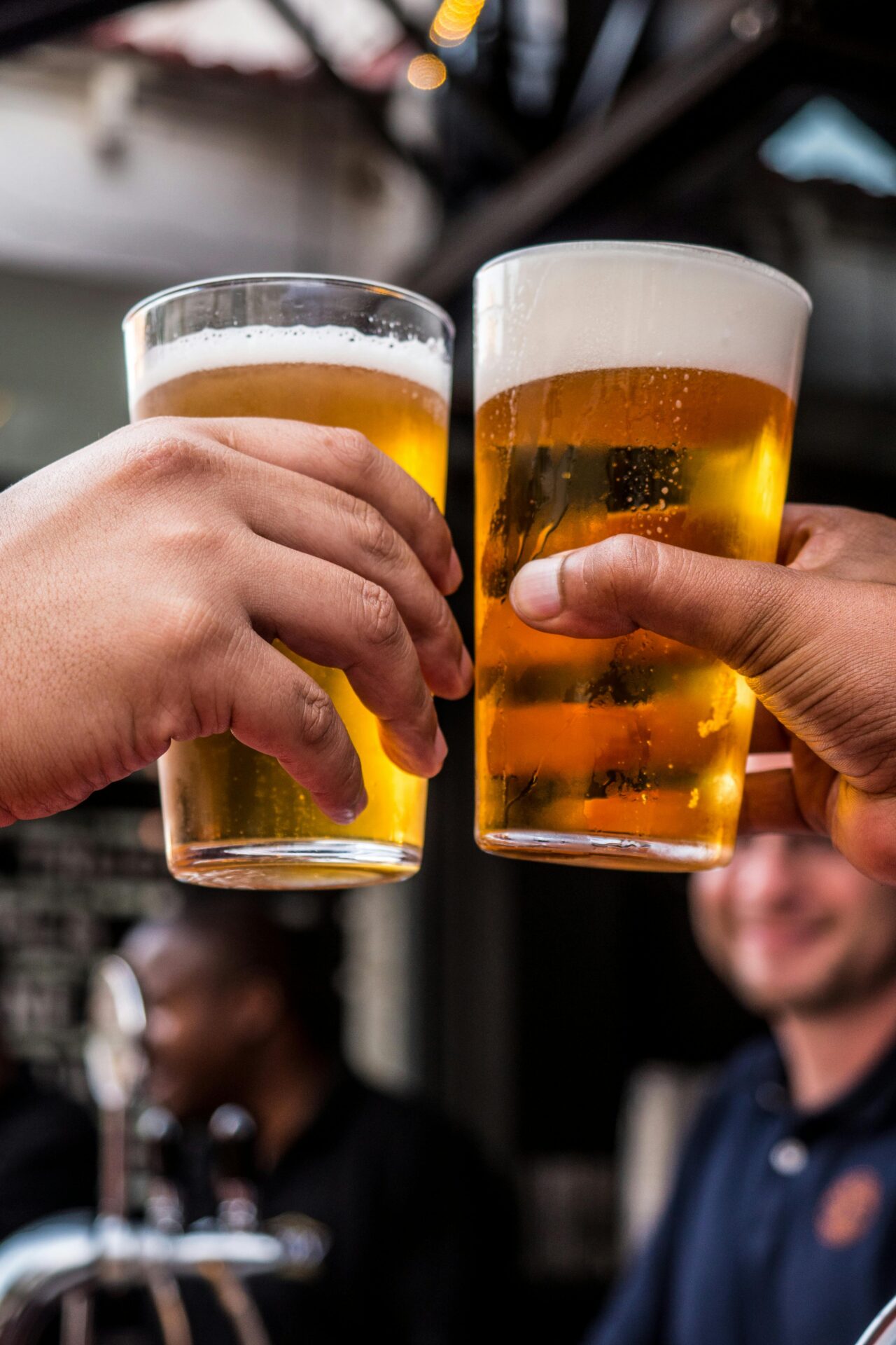 two beers cheersing